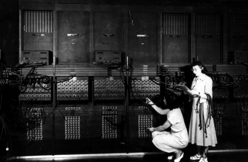Two women wiring a portion of ENIAC with a new program.